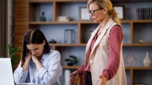 Boss speaking to nervous employee