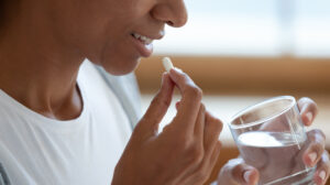 woman taking vitamin