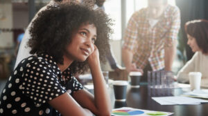 Woman daydreaming at work