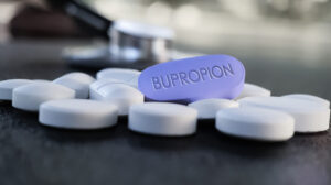 pills on table with bupropion label