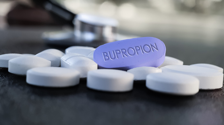 pills on table with bupropion label