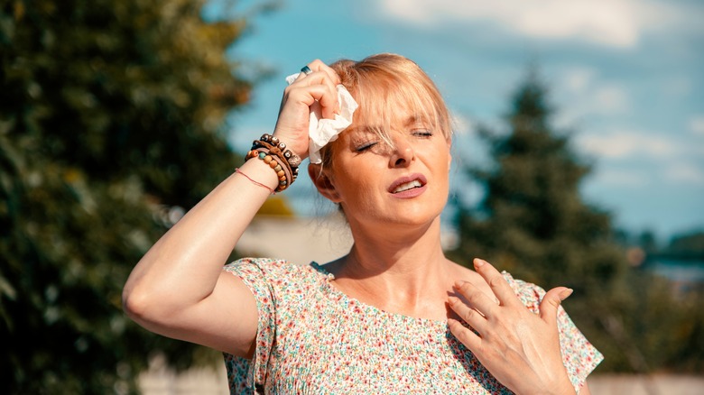 Woman panting in the sun