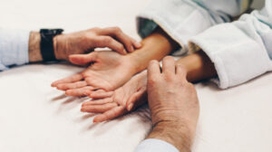 acupressure therapist massaging patient