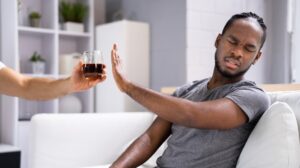 man refusing an alcoholic drink