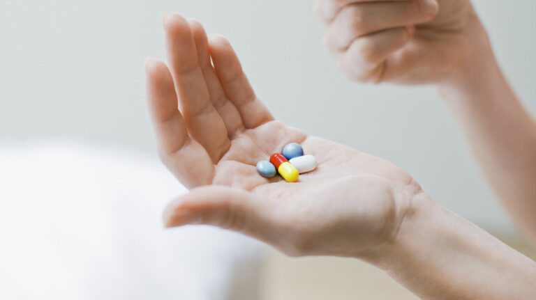 hand with several medications