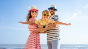 Happy family playing at beach
