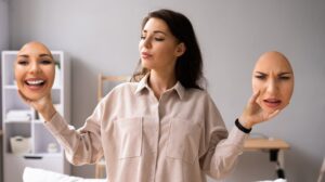 woman holding faces to mask self