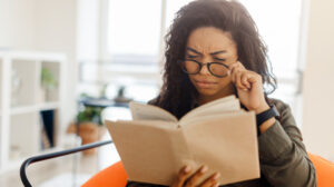 confused woman reading book