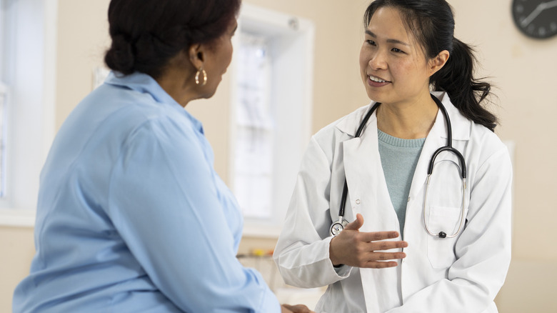 woman talking to doctor