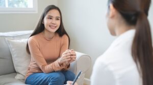 young woman talking to her therapist