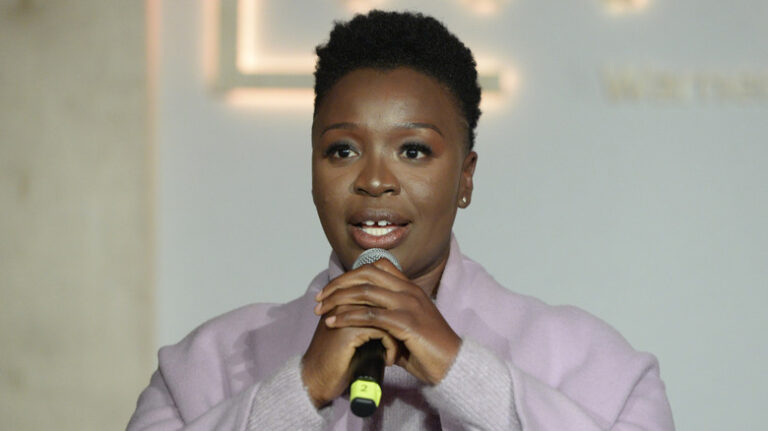 Folake Olowofoyeku speaking into a mic