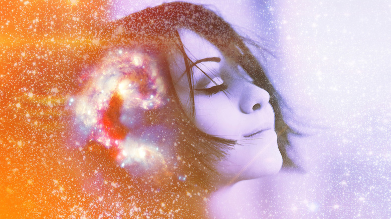 Smiling woman with cosmic brain activity