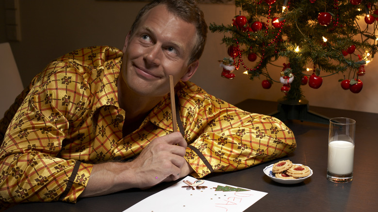 man with milk and cookies
