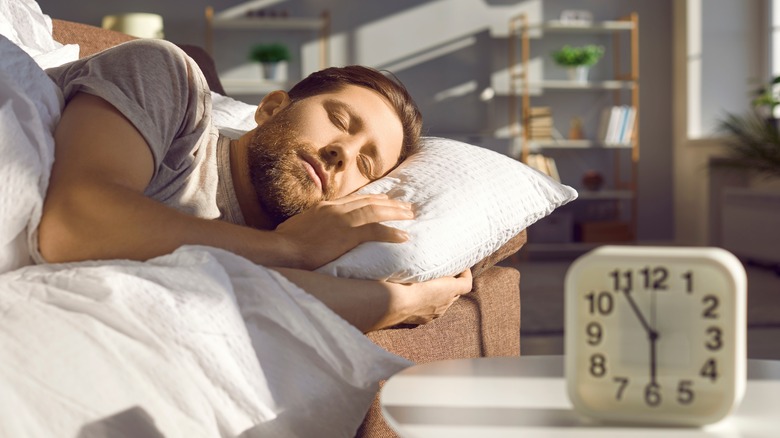 Man sleeping with alarm