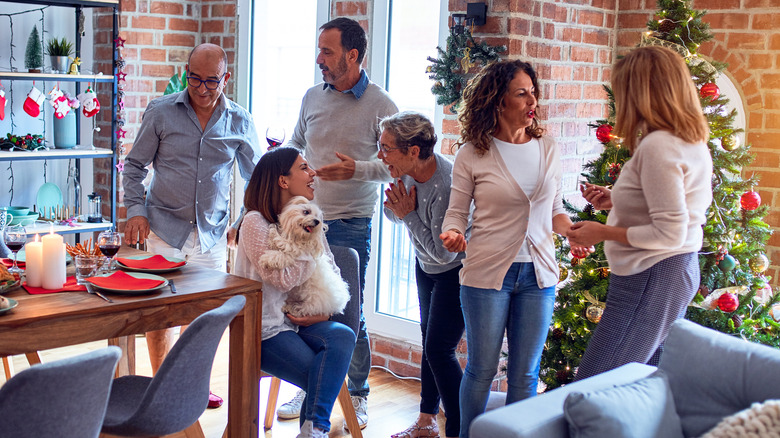 group gather at Christmas in house