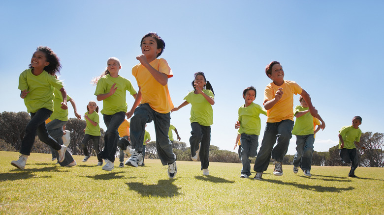 Group of children running outside