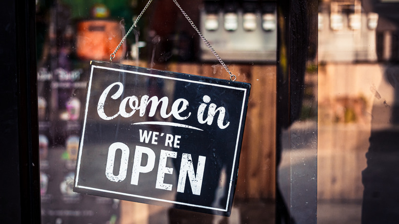open sign on a coffee shop door