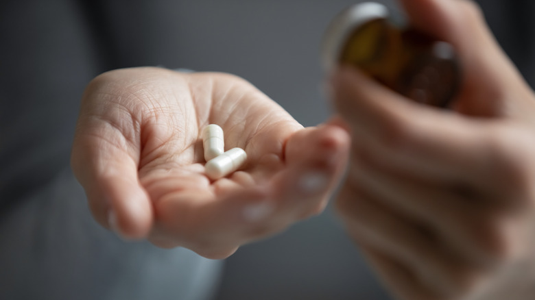 holding antidepressants in hand