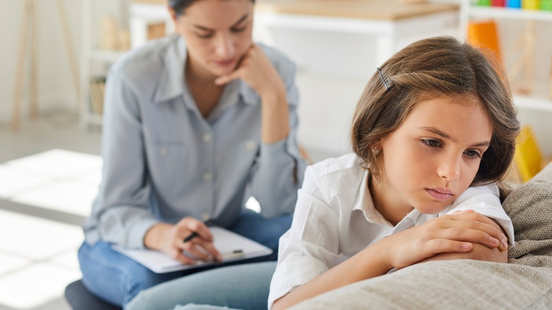 sad young girl getting therapy