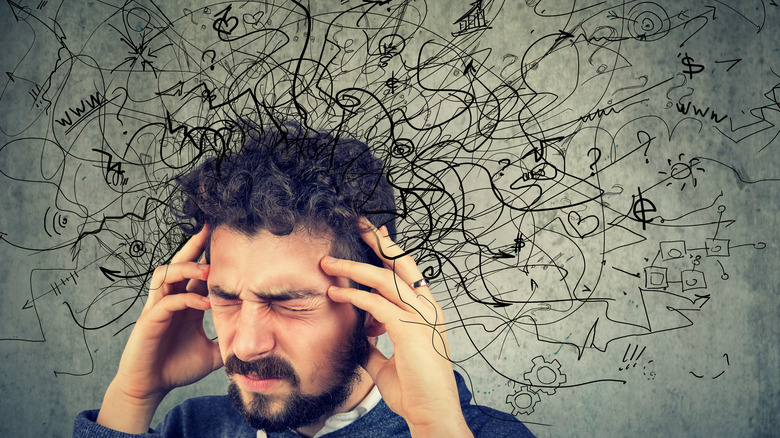 Lines illustrating stress surround man 