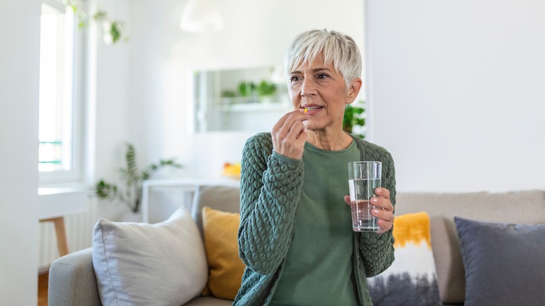 woman taking medication