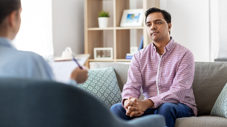 Man speaking with therapist