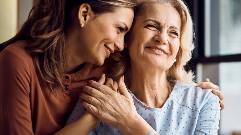 mother and daughter looking happy