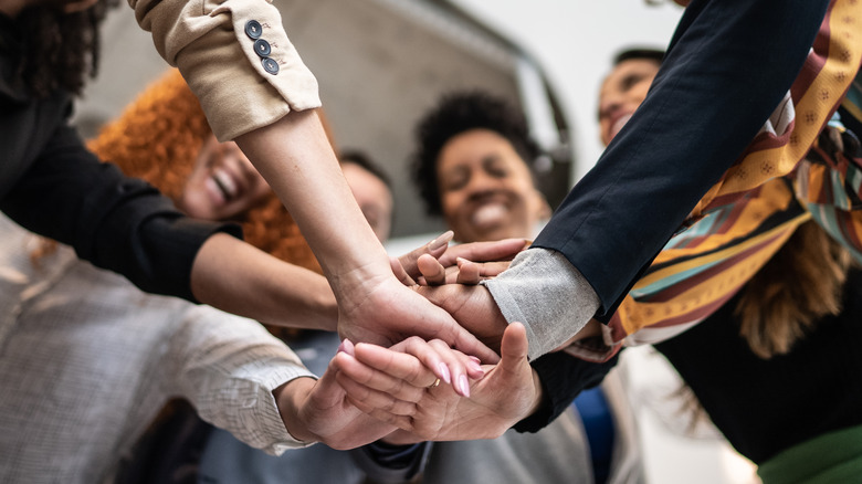 Office workers in a huddle