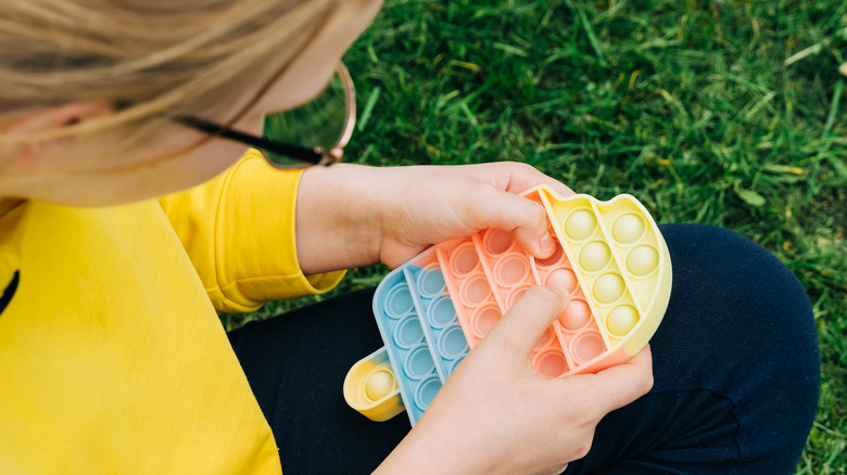 Girl playing sensory game outside