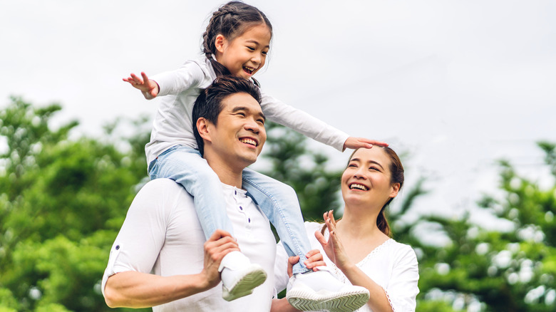 Smiling happy family outside