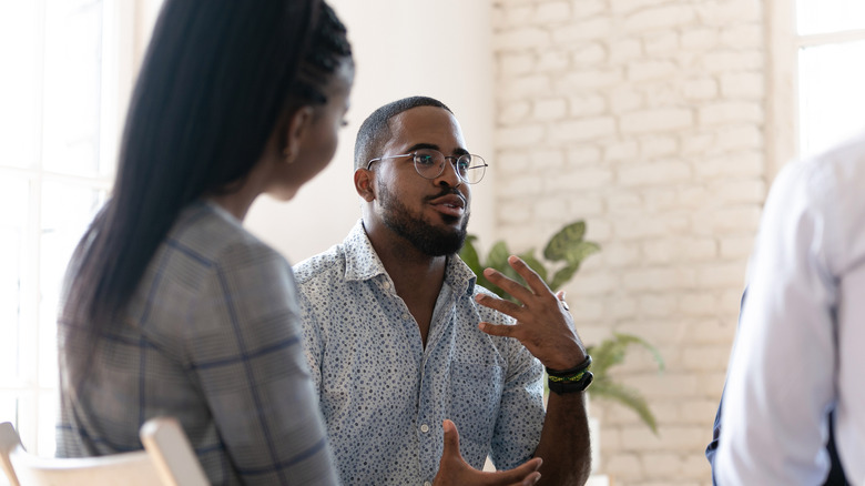 Man speaking in group therapy