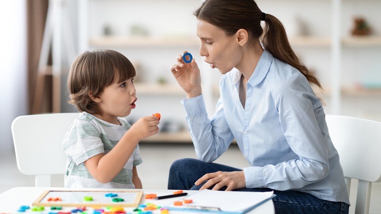 Child working with reading specialist