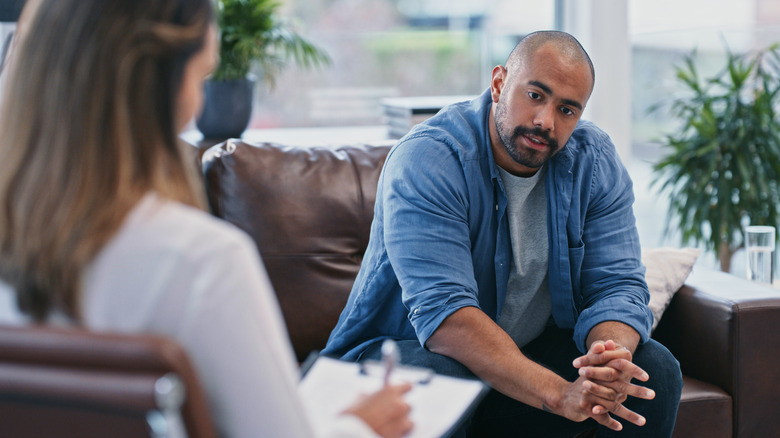 man confiding in his therapist