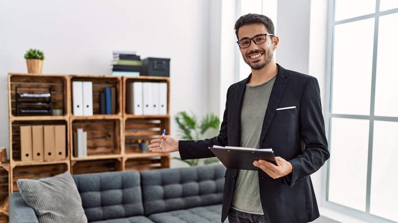 male therapist welcoming into office