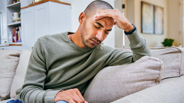 Stressed man on couch