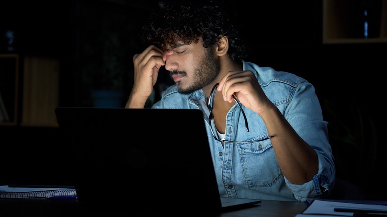 Asian man working at night