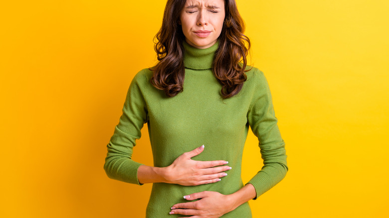 woman with upset stomach